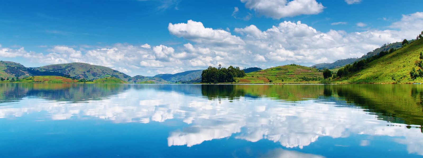 Lake Bunyonyi reflecting the hills on a 10 day Uganda safari