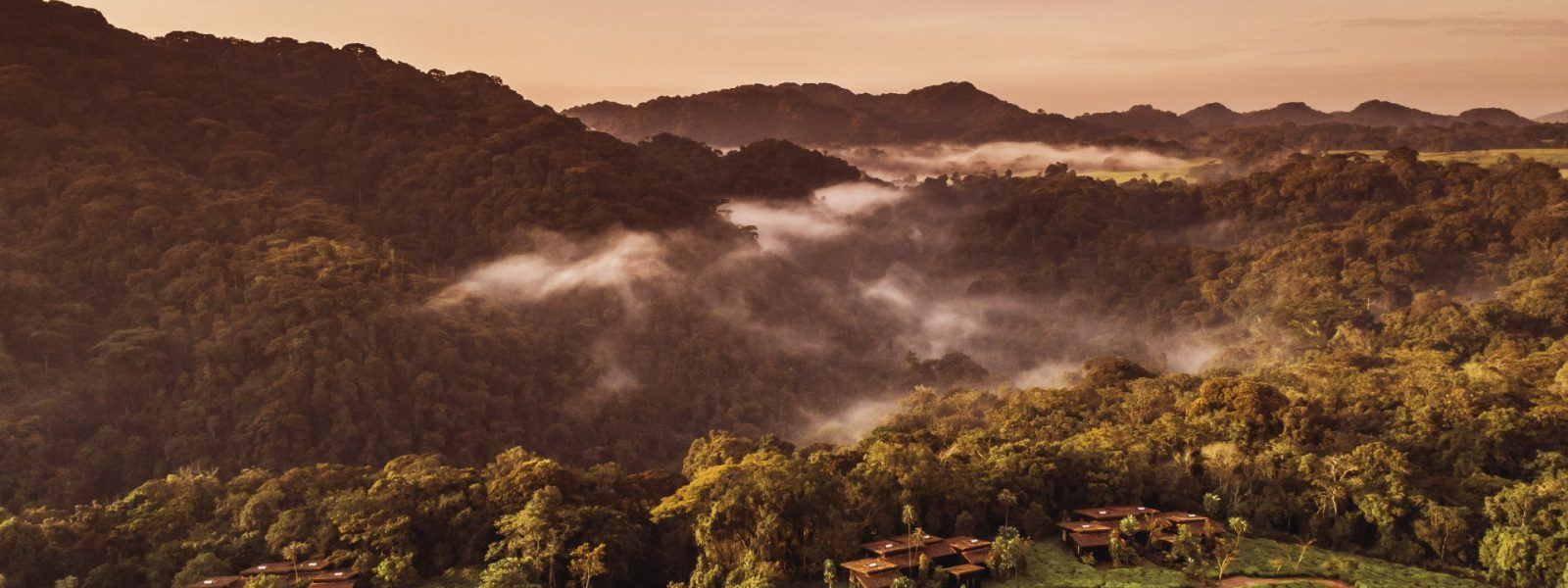 Sunrise over misty Rwandan hills on an 8 day Rwanda safari