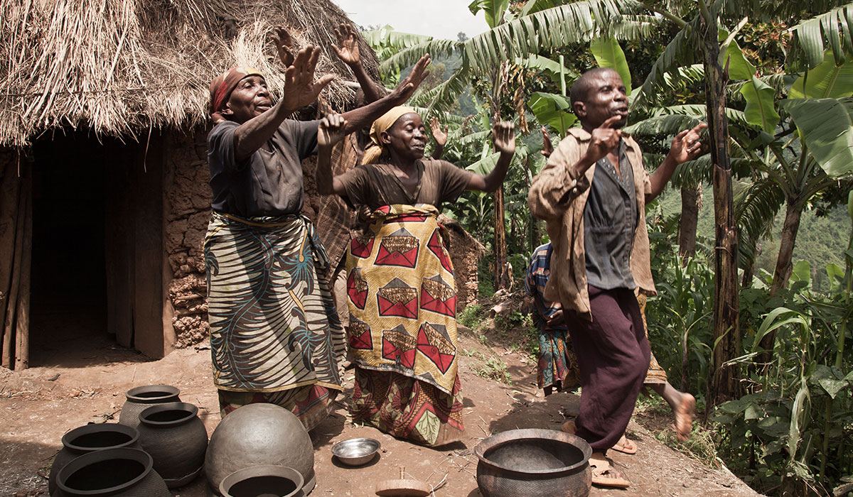 Villagers sharing traditional crafts on a community tour in Uganda