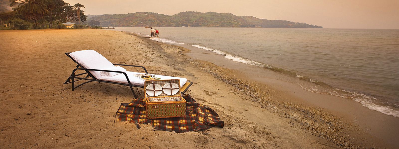 Lakeside beach with loungers after gorilla trekking in Rwanda
