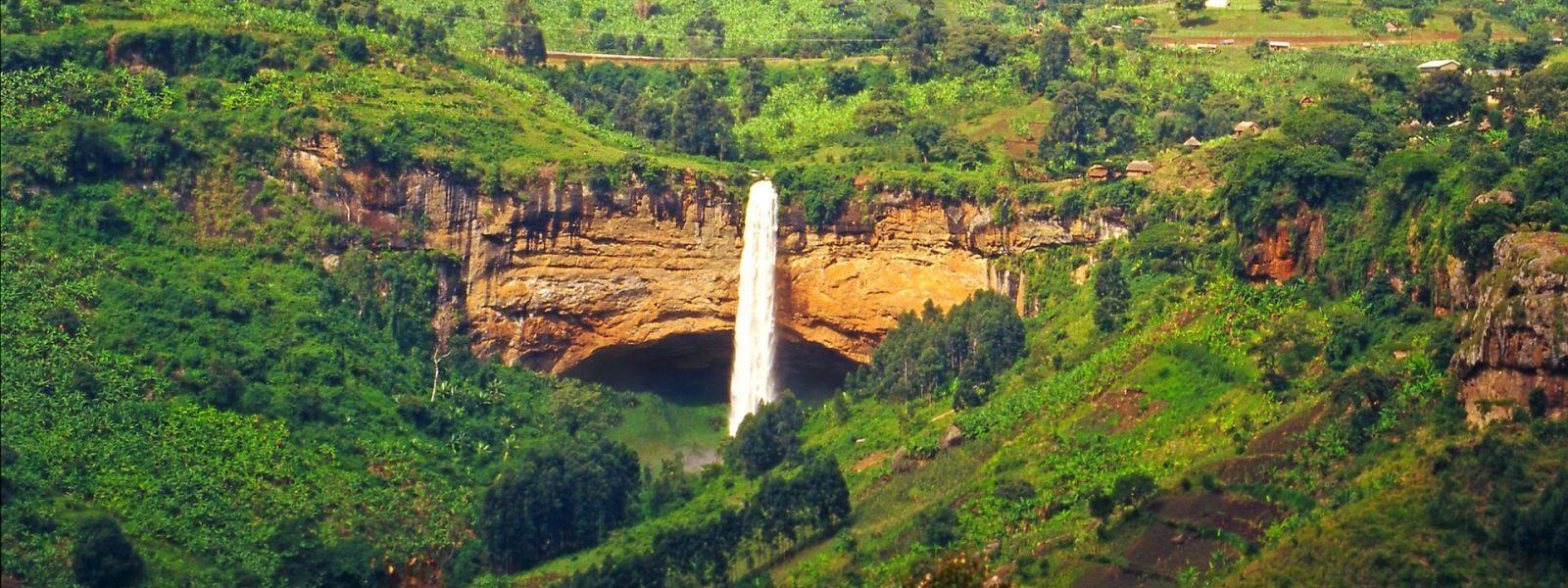 Sipi Falls dropping into a green valley on the Mount Elgon and Sipi Falls tour